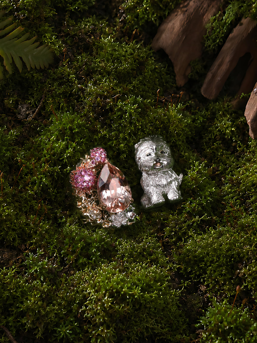 Open ring view: silver Westie dog, halo of pink stones, and oval clear centerpiece