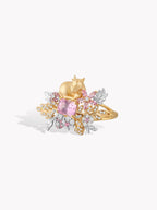 Gold deer garden ring with purple oval center stone and gold-and-silver floral detailing