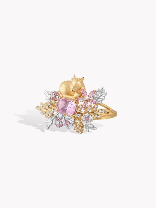 Gold deer garden ring with purple oval center stone and gold-and-silver floral detailing