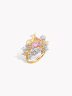 Gold deer garden ring with purple oval gemstone center and floral leaf accents