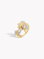 18k gold flower twist ring angled view with pavé floral details