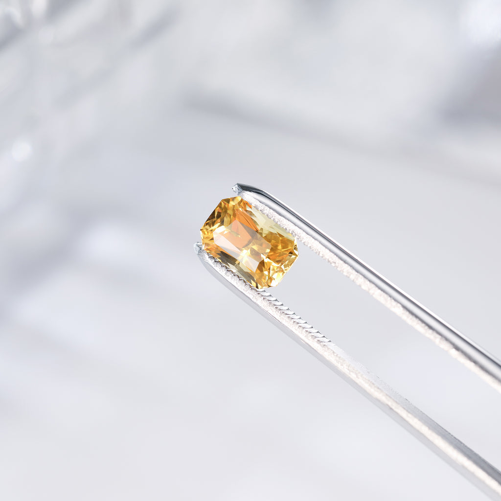 Rectangle yellow sapphire gemstone in silver prong setting