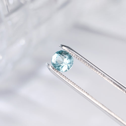 1.1ct cushion-cut tourmaline gemstone in prong setting, light blue