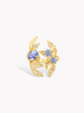 Gold-tone laurel leaf ring with round light-blue center and clustered blue stone details