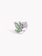Cactus gemstone ring with purple oval center and green raised cactus, silver band