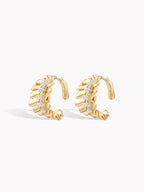 Gold ruffle diamond ear cuff pair with hinged open back and scalloped edges
