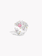 Floral branch ring with pink center gemstone and side branch cluster