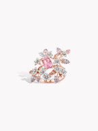 Rose gold statement ring with pink marquise center and glittering flower-like side stones