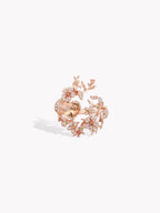 Heart-shaped branch ring in rose gold with floral motifs and pink-toned gemstones