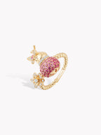 Gold-tone gourd fortune ring with pink textured bezel and beaded band