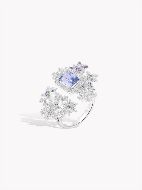Snowflake-inspired ring, three-quarter view, square blue gemstone and halos