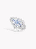 Hydrangea-style blue gemstone ring with clear halo and oval sapphire accents