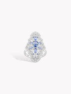 Sapphire blue cluster hydrangea ring with pavé set stones and silver-toned band