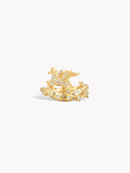 Gold-tone pegasus ring with blue accents, side angle view