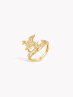 Gold-tone pegasus ring with blue accents and detailed stonework