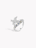 Silver pegasus ring with blue gemstones, side view of band and wing details