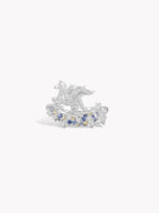 Silver pegasus motif ring with blue gemstone clusters and wings on top