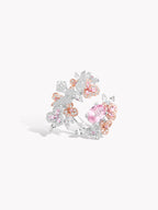 Sterling silver floral ring with pink and orange oval gemstones and clear accents
