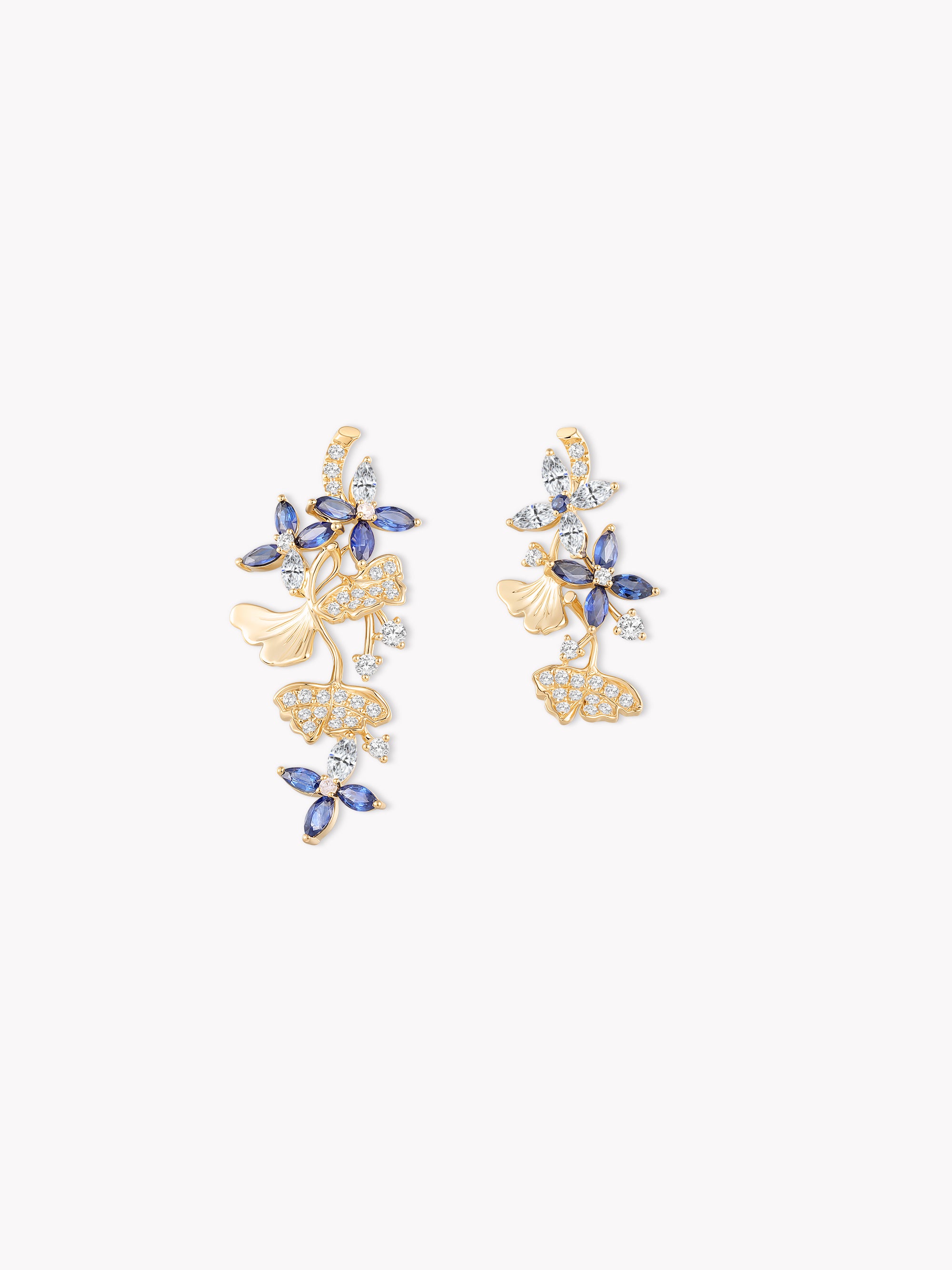 Gold ginkgo earrings with blue gemstone leaves and dangling charms