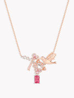Rose-gold bird and cherry blossom necklace with pink crystals and dangling pink stone
