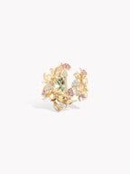 Gold-tone strawberry cluster ring with central light green stone and light purple stones