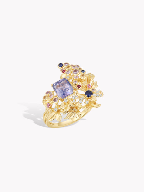 Gold grape-vine cluster ring with purple sapphire center and small gemstone accents