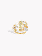 Gold ring with floral cluster of white and yellow stones, openwork setting