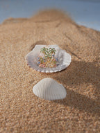 Gold-tone ring with green palm-tree motif and blue and pink gemstones