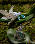 Test ring gemstone detail with blue teardrop stones and silver setting
