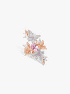Butterfly gemstone ring with pink oval center, rose-gold band and pavé crystal wings