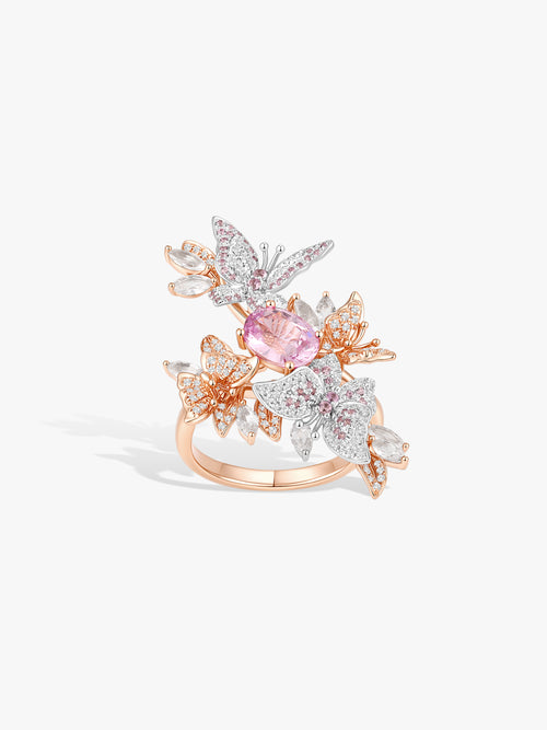 Butterfly wing gemstone ring with pink center stone and rose-gold and crystal accents