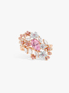 Rose-gold ring with pink oval center stone and multicolor floral side clusters