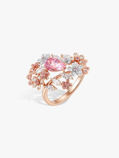 Rose-gold ring with pink oval center stone and flower halo with diamond accents