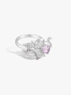 Swan Lake ring, purple oval spinel center with diamond pavé swan details