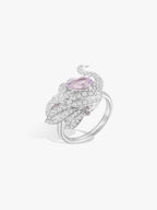 Swan Lake ring with purple oval spinel bezel and sparkling diamond pavé bands
