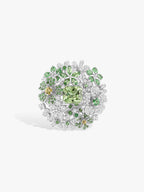 Mint green floral diamond ring with round perimeter stones and clustered leaf motifs