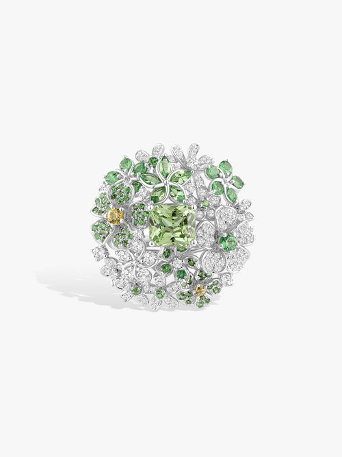 Mint green floral diamond ring with round perimeter stones and clustered leaf motifs