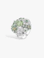Mint green floral gemstone diamond ring with round halo and leaf-like settings