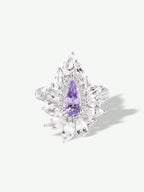 Purple marquise gemstone cluster ring with leaf-like halo and prong-set stones