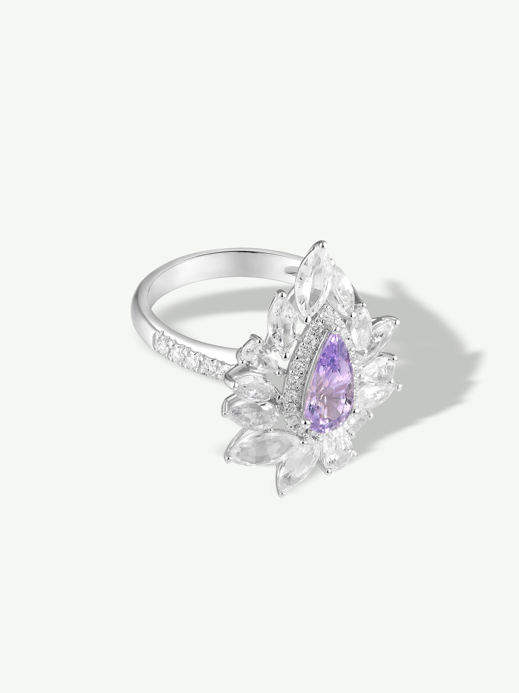 Purple marquise gemstone halo ring with glittering side stones, silver-tone band