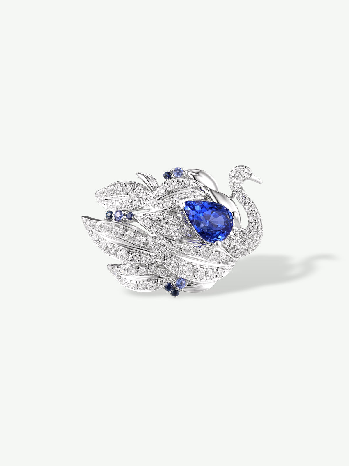 Swan ring with teardrop blue sapphire and pavé diamond details