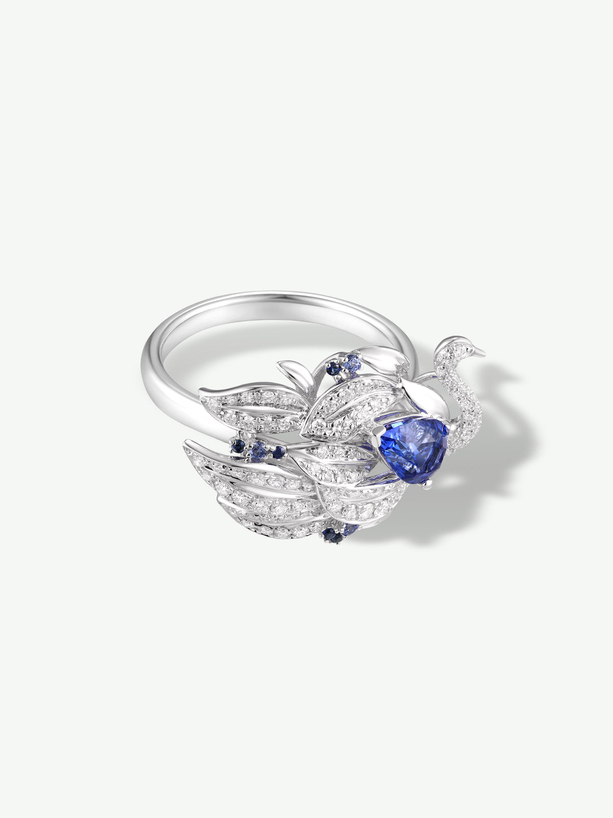 Swan-shaped silver ring with teardrop blue sapphire and pavé accents