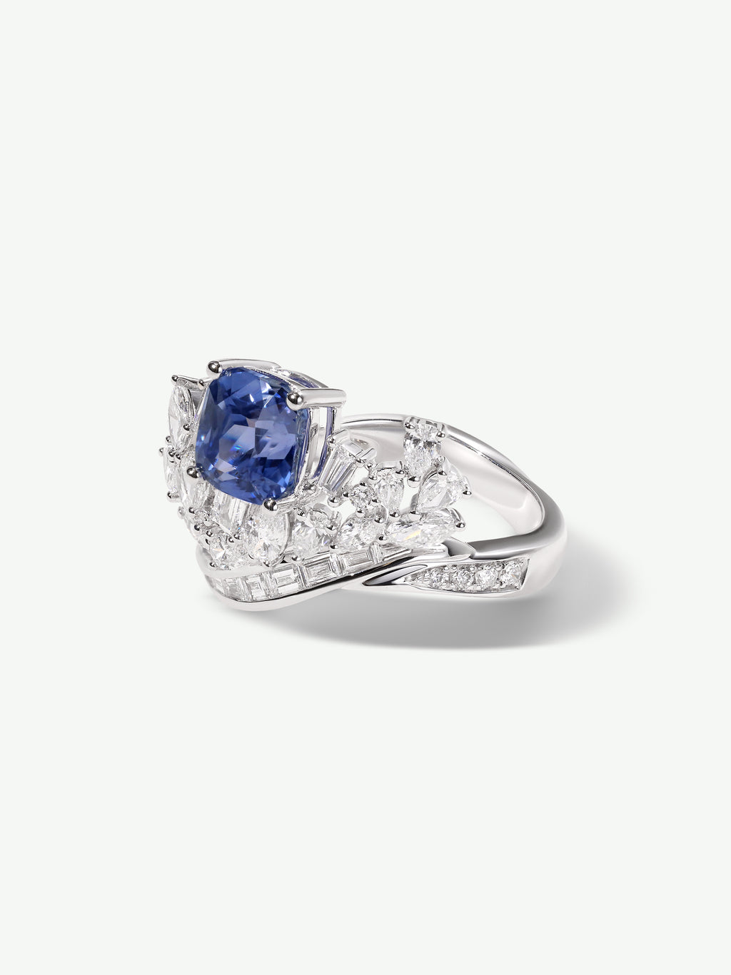 Sapphire blue square center ring with side diamond clusters on polished silver band