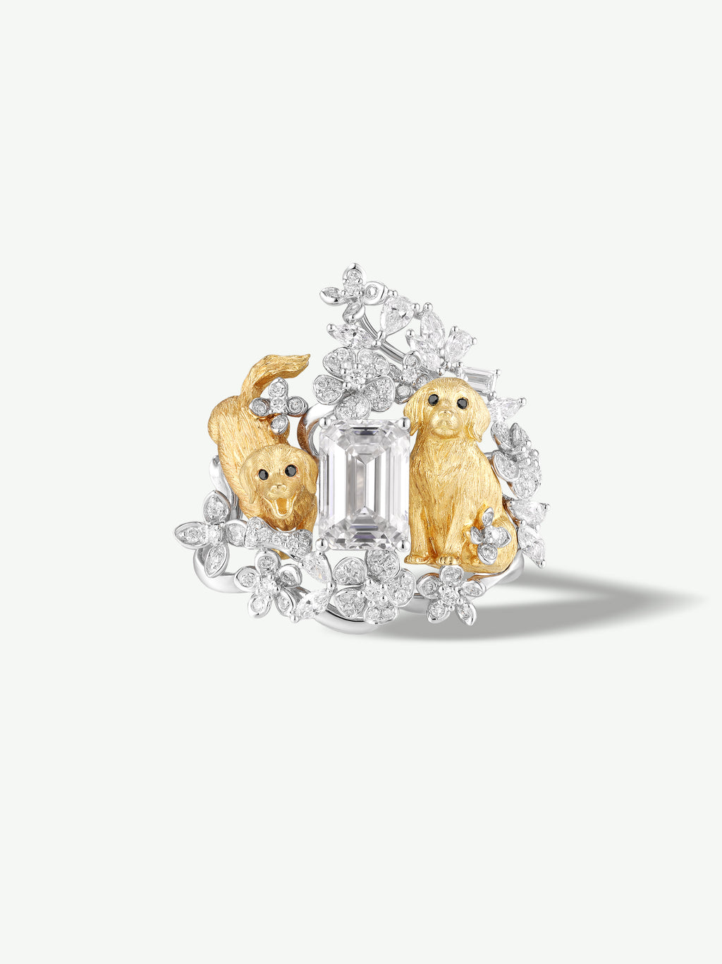 Diamond puppy and floral ring; central baguette stone with two gold-tone puppy figures