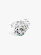 Cat-shaped silver ring, side view; green center stone with pink purple and blue accents