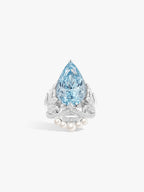 Pear-shaped aquamarine gemstone ring with ornate crown, wing motifs, and pearl accents