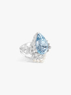 Aquamarine crown and wing ring with pear-cut blue gemstone and pearl drop detail