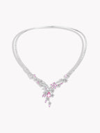 Silver necklace with pink gemstone sakura floral pendant and dangling stones