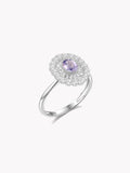 Silver amethyst ring with oval purple center stone and diamond halo, split prongs