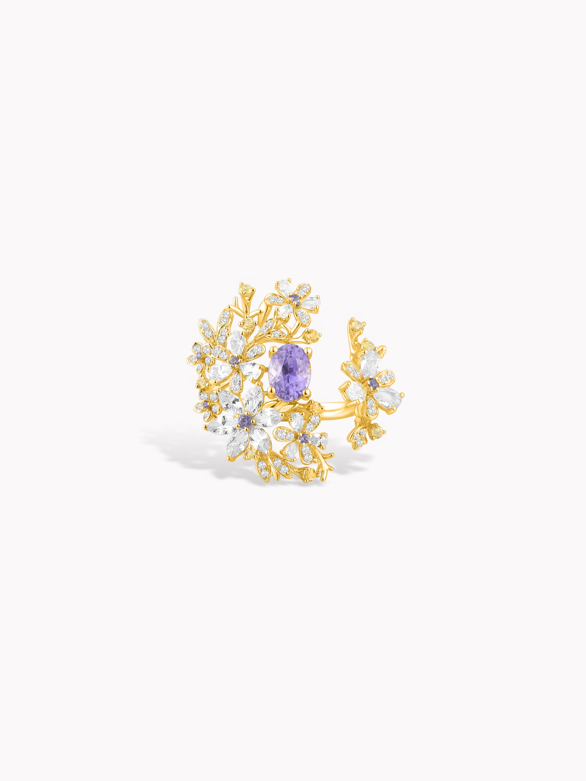 Floral branch ring in yellow gold with purple center stone and clear accents